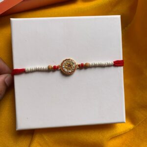 Classic Pearl Rakhi with Central Floral Motif